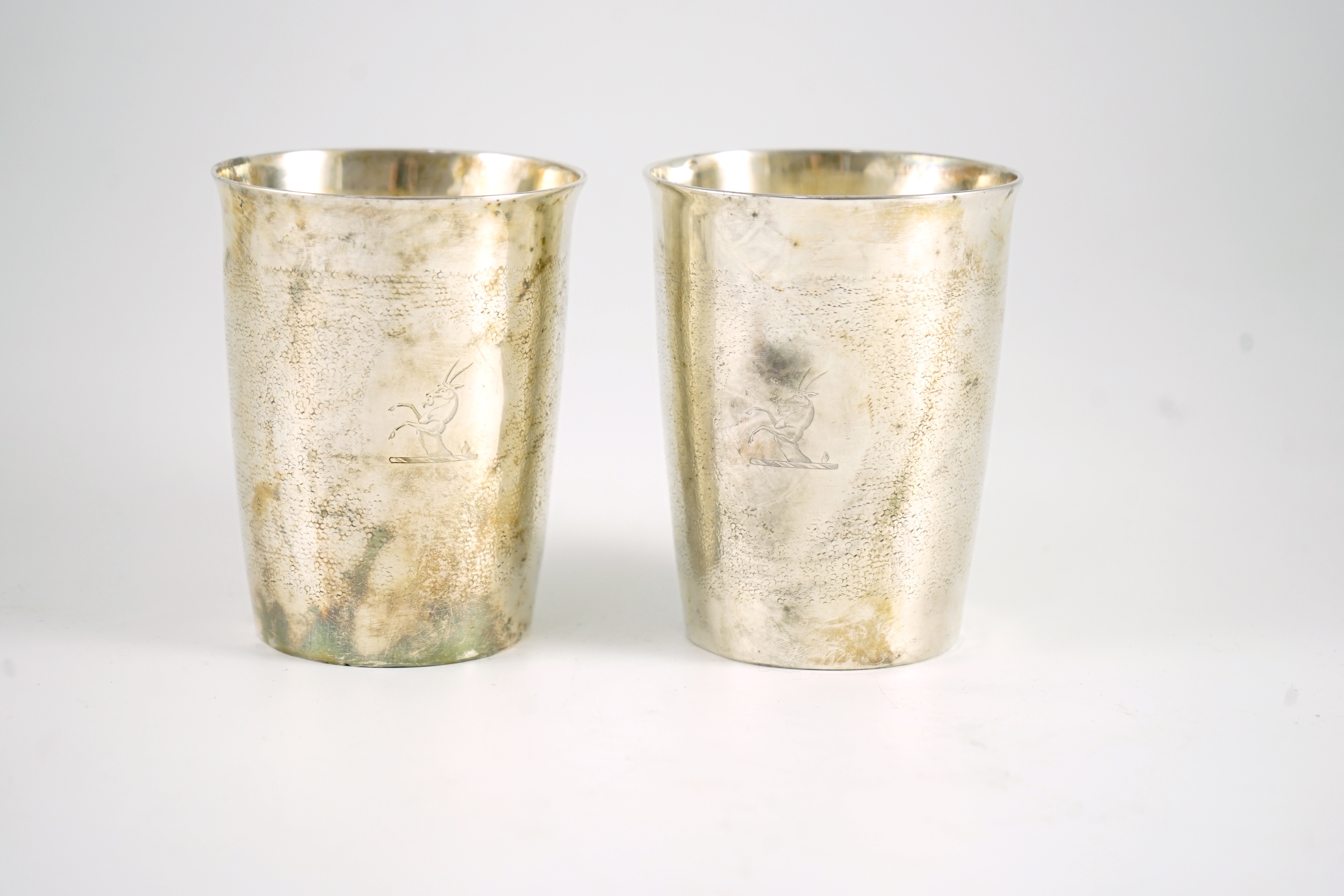 A pair of George III part textured silver beakers, by Henry Chawner